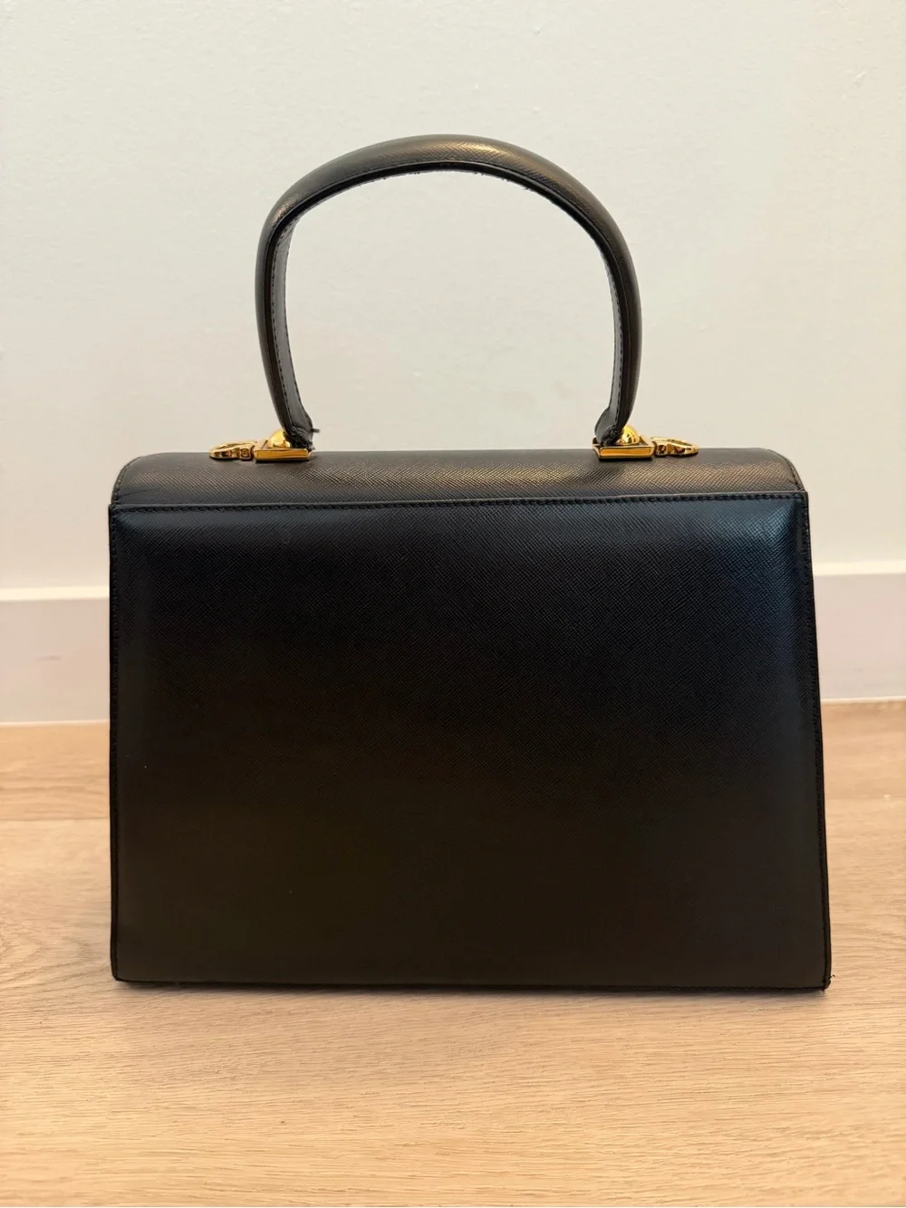 Vintage Salvatore Ferragamo Black Top-Handle Bag with Gold Gancini Closure